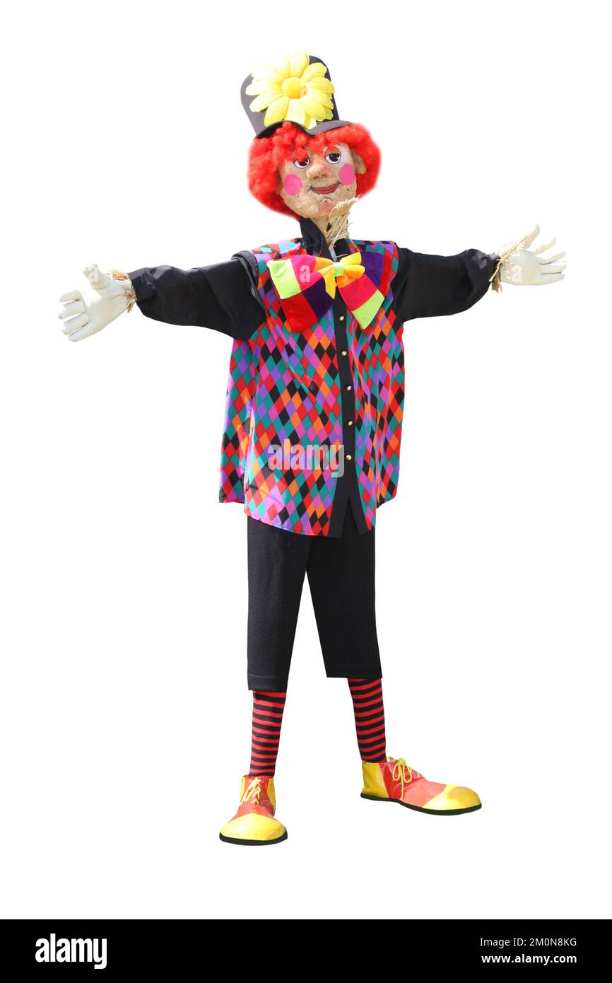 Un felice Clown Scarecrow fatto di paglia. Foto Stock