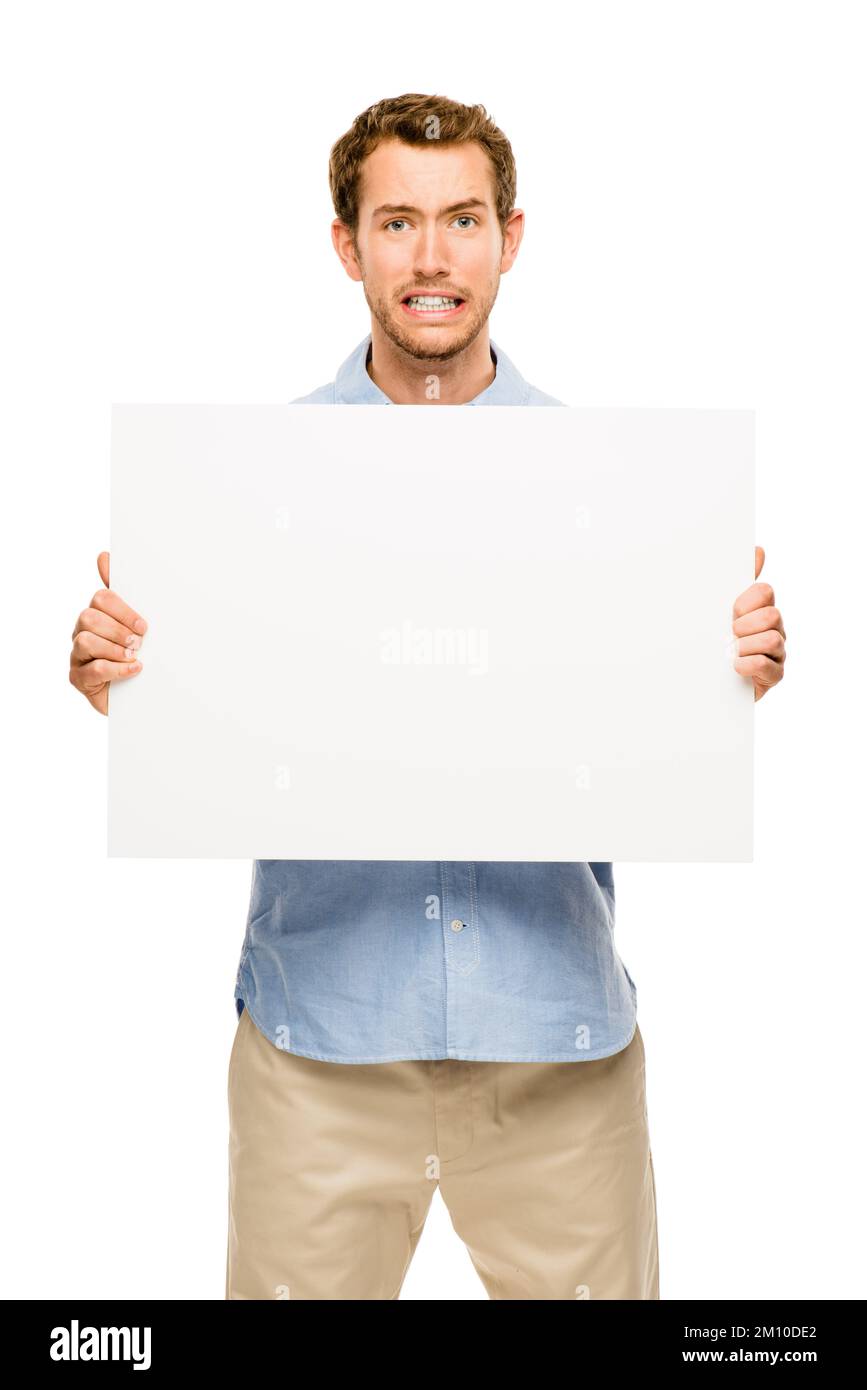 Lo spazio perfetto per i tuoi sogni. un uomo d'affari che tiene un cartello bianco contro uno sfondo studio. Foto Stock