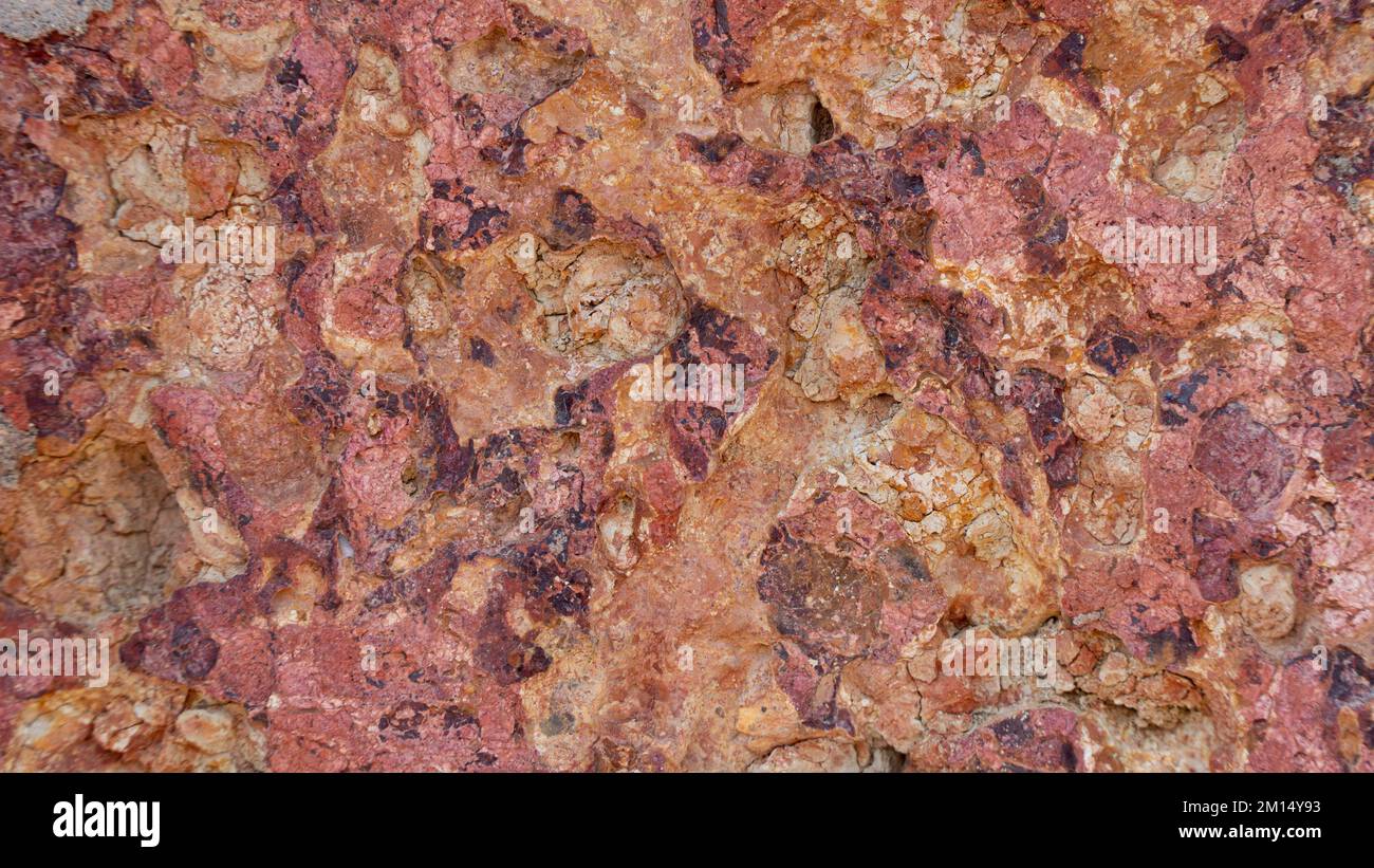 La struttura della pietra è rosso arancio, mattone, materiale di fondo Foto Stock