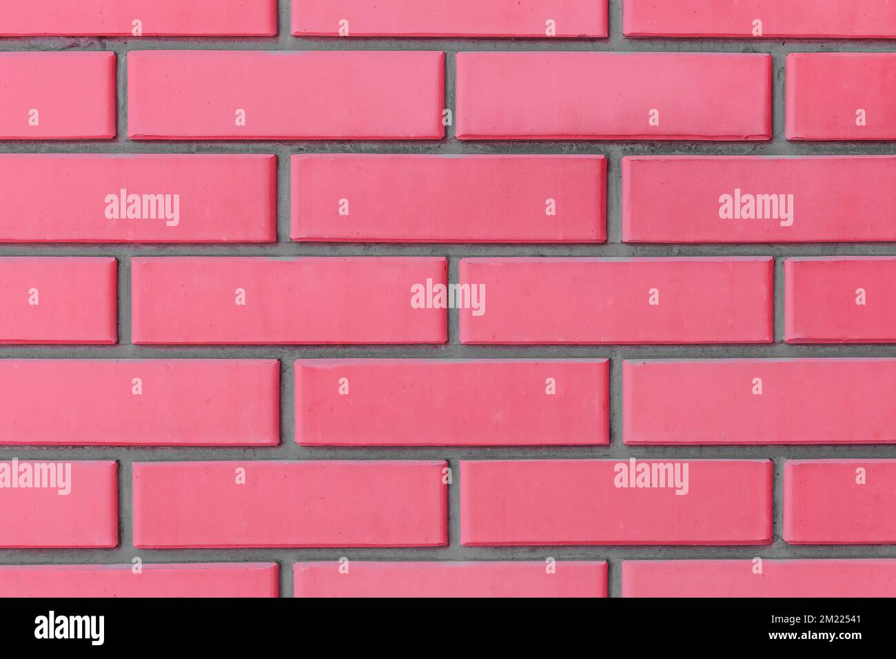 Luce cremisi rosso rosa colore mattone blocchi parete struttura sfondo  mattoni Foto stock - Alamy