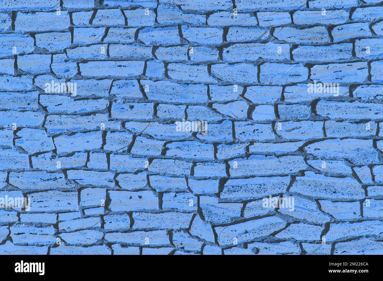 Vecchio muro di mattoni in pietra blu, struttura esterna moderna, sfondo della facciata. Foto Stock