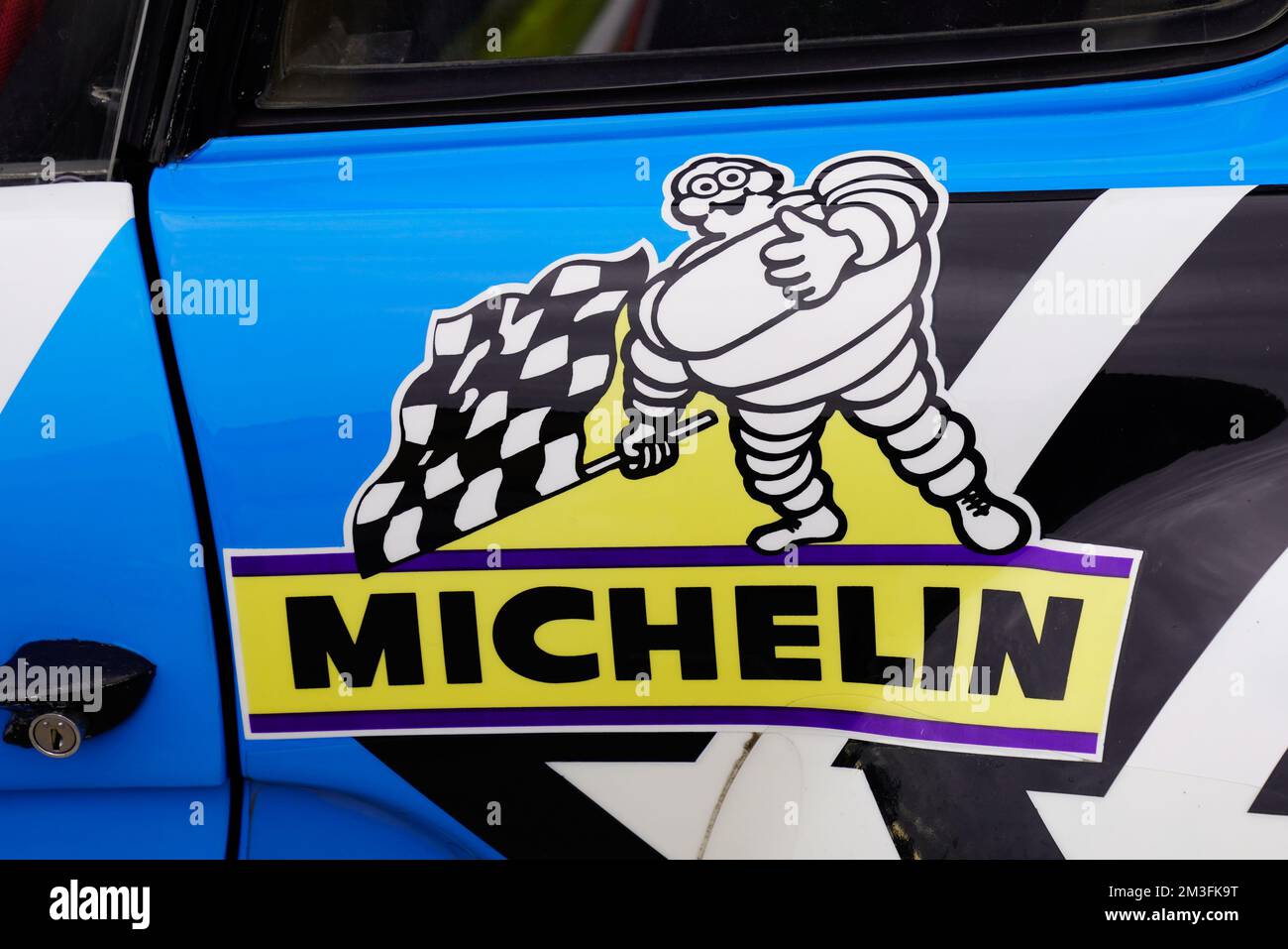 Bordeaux , Aquitaine France - 11 06 2022 : testo Michelin marchio e logo segno sulla gara rally lato auto del produttore di pneumatici sport auto da corsa Foto Stock