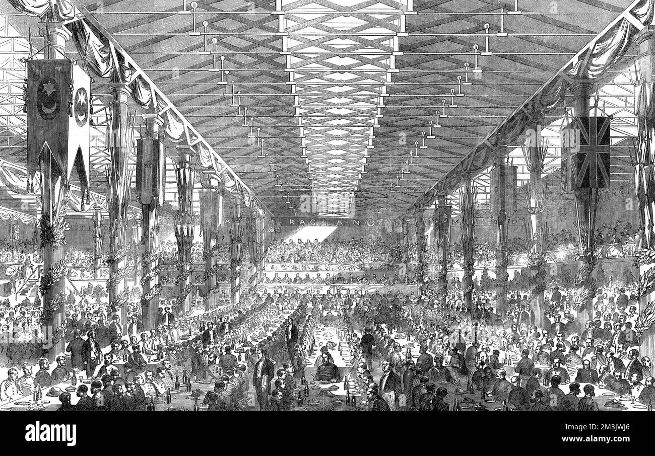 Panoramica un banchetto per i veterani di guerra di Crimea nello Stack A, un magazzino nei Docklands di Dublino, che si tiene il 22nd 1856 ottobre. Organizzato dal governo irlandese per onorare le 3.600 truppe che erano recentemente rientrate dalla Crimea, il magazzino del tabacco, che è stato trasformato con arredamento e composizioni floreali, è stato trovato per essere l'unico luogo abbastanza grande per contenere un così grande numero di persone. Attorno al muro erano appesi striscioni che celebravano le varie battaglie. Data: 1856 Foto Stock