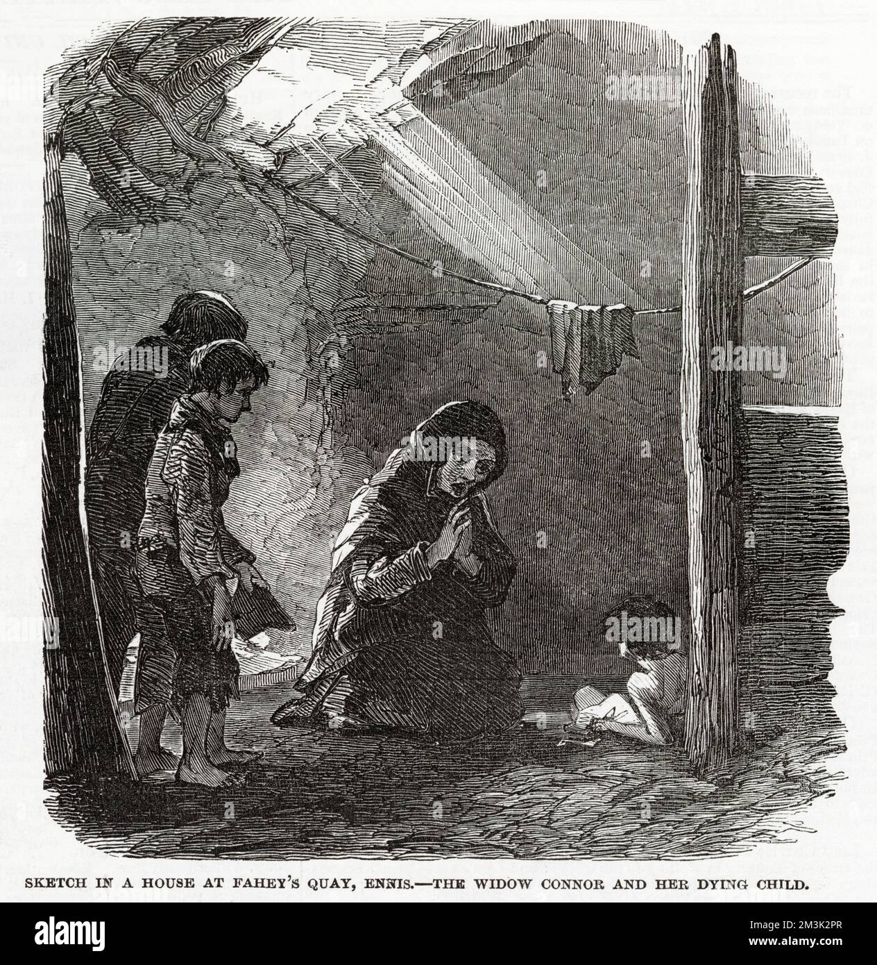 Una casa a Fahey's Quay, Ennis, Irlanda, che mostra la vedova o'Connor che prega per il suo bambino morente. Le condizioni squallide dei poveri sono il riflesso della miseria perpetuata dalla carestia delle patate, dagli sfratti degli agricoltori inquilini e dalla cattiva legislazione che è stata estesa all'Irlanda. Foto Stock