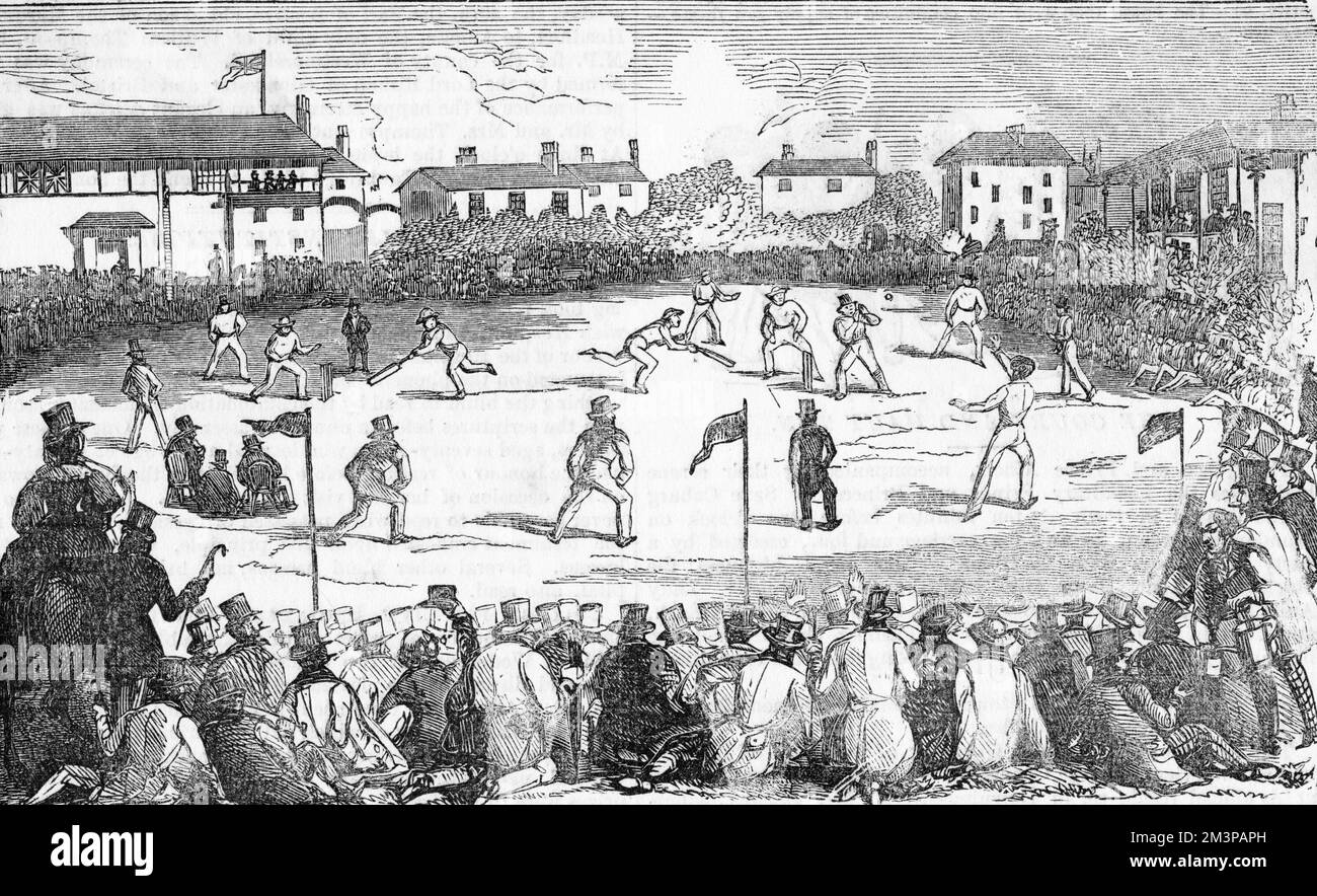 Una partita di cricket in corso al Signore, gli spettatori si siedono intorno e guardano la partita. Foto Stock