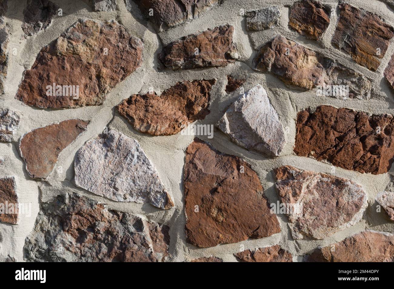 Muro di pietra e marmo sfondo. Bella texture di pietra vecchia. Foto Stock