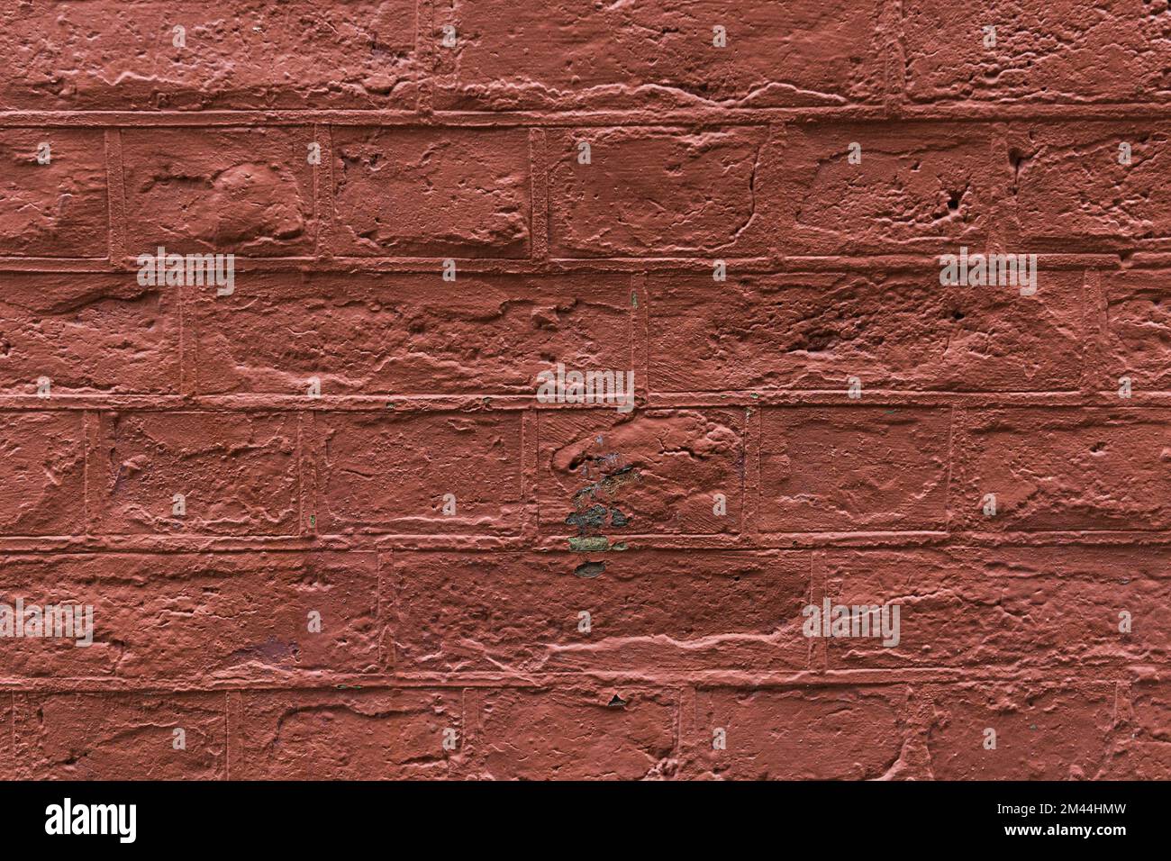 La struttura del muro di mattoni dipinti in rosso. Foto Stock