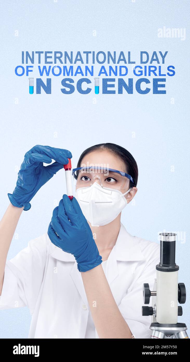 Gli scienziati asiatici stanno tenendo provette con fondo colorato. Giornata Internazionale delle Donne e delle Ragazze nella Scienza Foto Stock