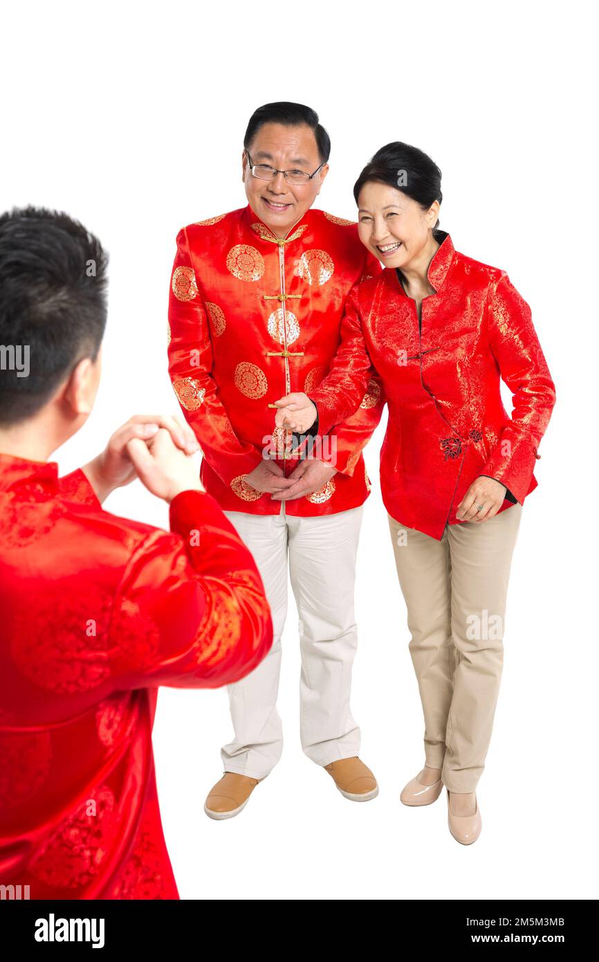 Felice famiglia di abbigliamento del Capodanno cinese Foto Stock