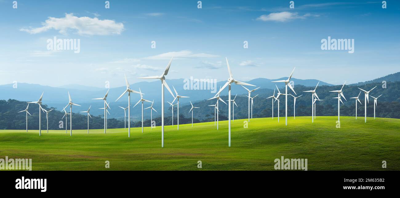 Turbine eoliche in un campo con un bellissimo paesaggio. Immagini concettuali di fonti di energia rinnovabili, ecologiche e sostenibili Foto Stock