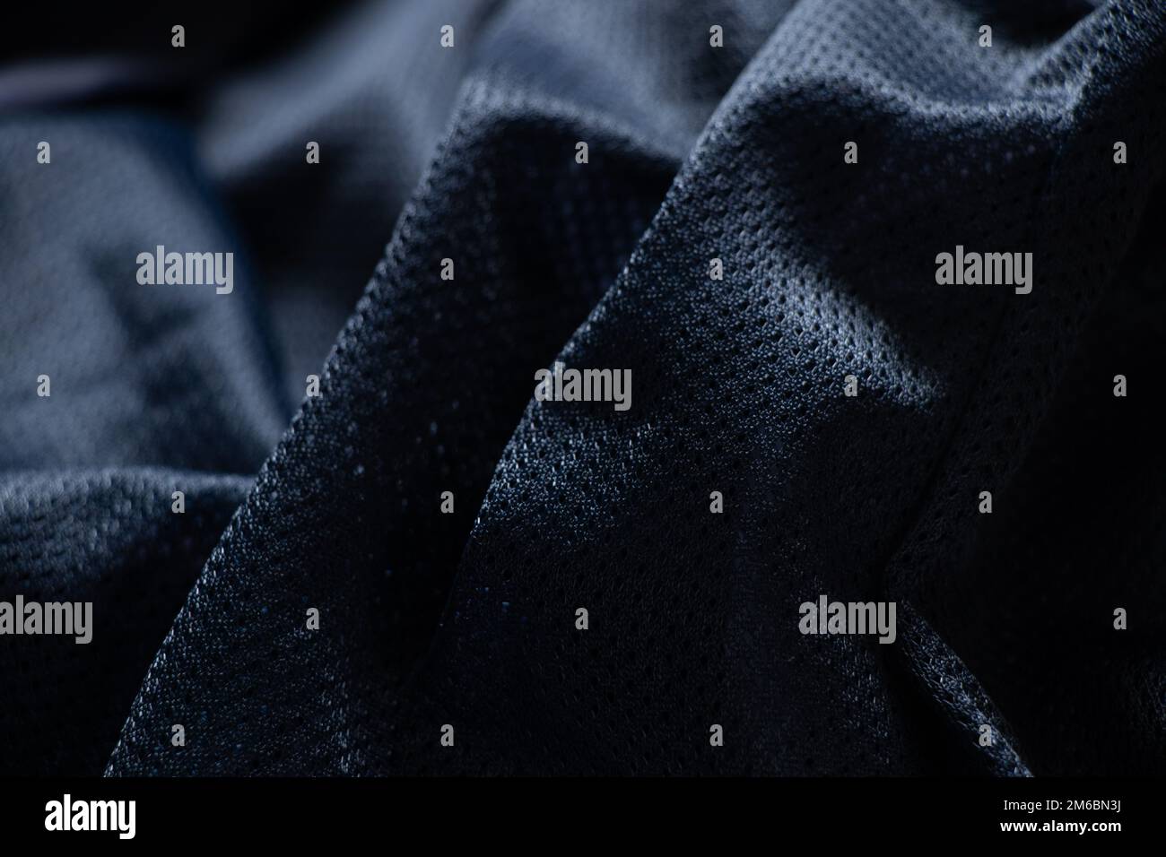 tessuto blu scuro stropicciato come primo piano dello sfondo Foto Stock