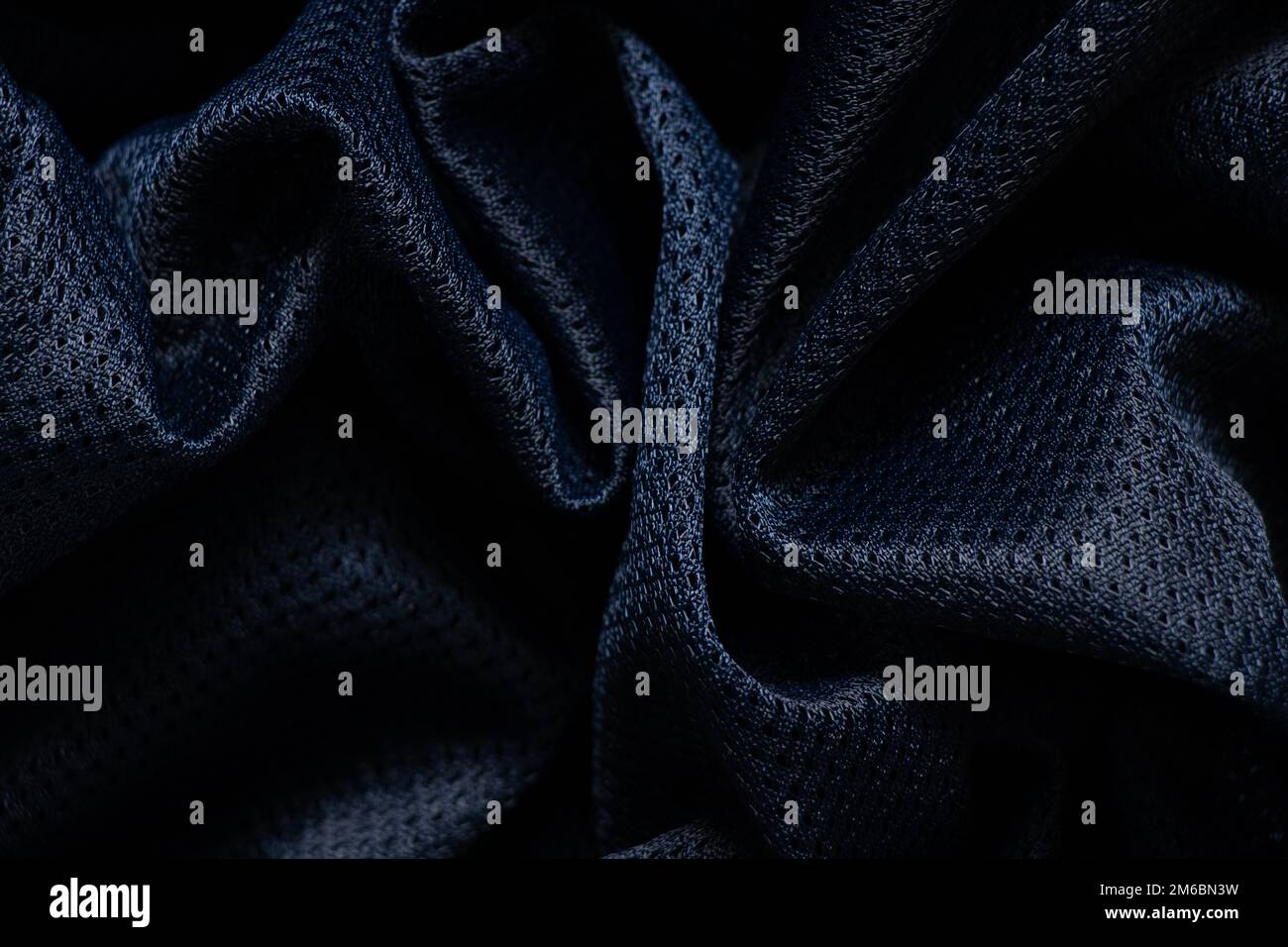 tessuto blu scuro stropicciato come primo piano dello sfondo Foto Stock