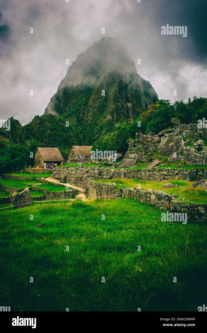 I turisti in Machu Picchu rovine. Foto Stock