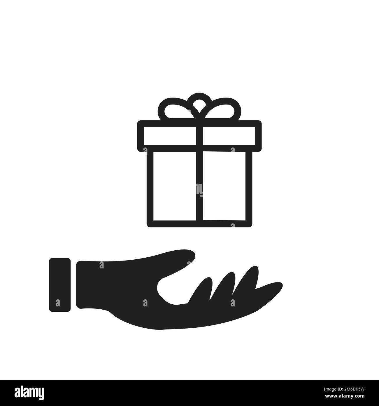 Icona di presenza con mano isolata. Regali di natale icona. Simbolo isolato di celebrazione. Foto Stock