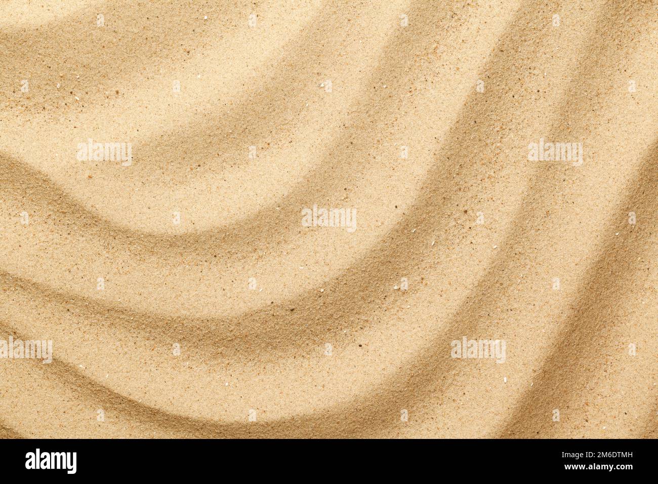 Sfondo di sabbia marina ondulata Foto Stock