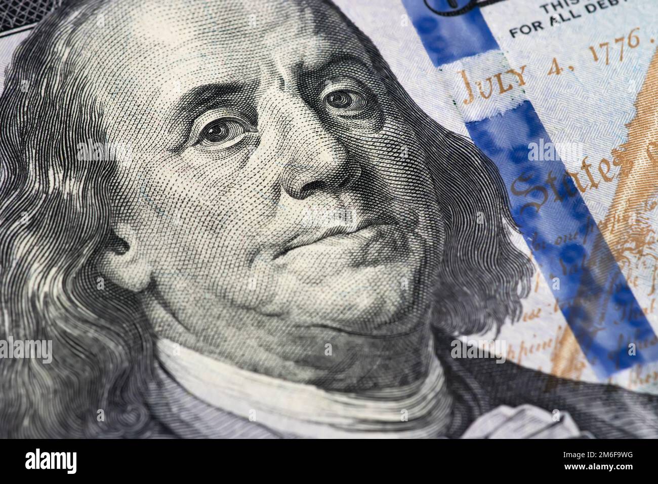 Macro primo piano del volto di ben Franklin sul conto degli Stati Uniti da 100 dollari Foto Stock