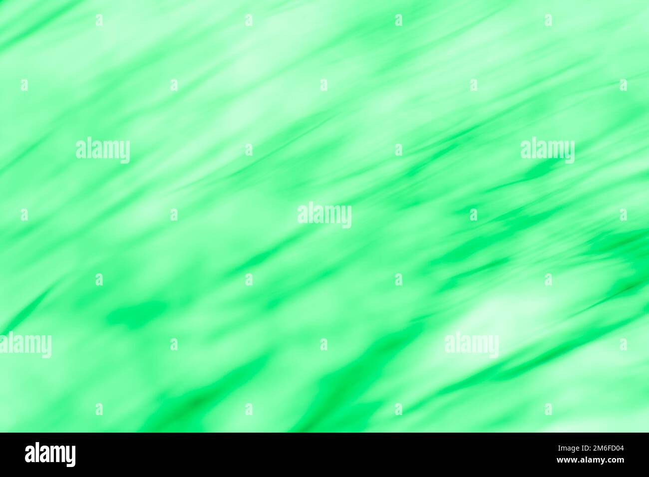 Vortice astratto effetto sfocato sfondo verde. Movimento radiale sfondo verde astratto. Foto Stock