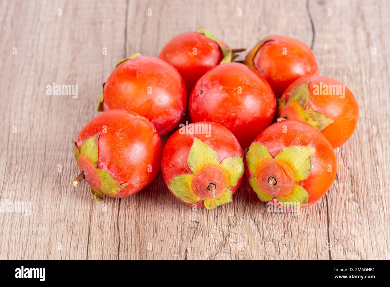 Persimmons frutta su tavola di legno Foto Stock
