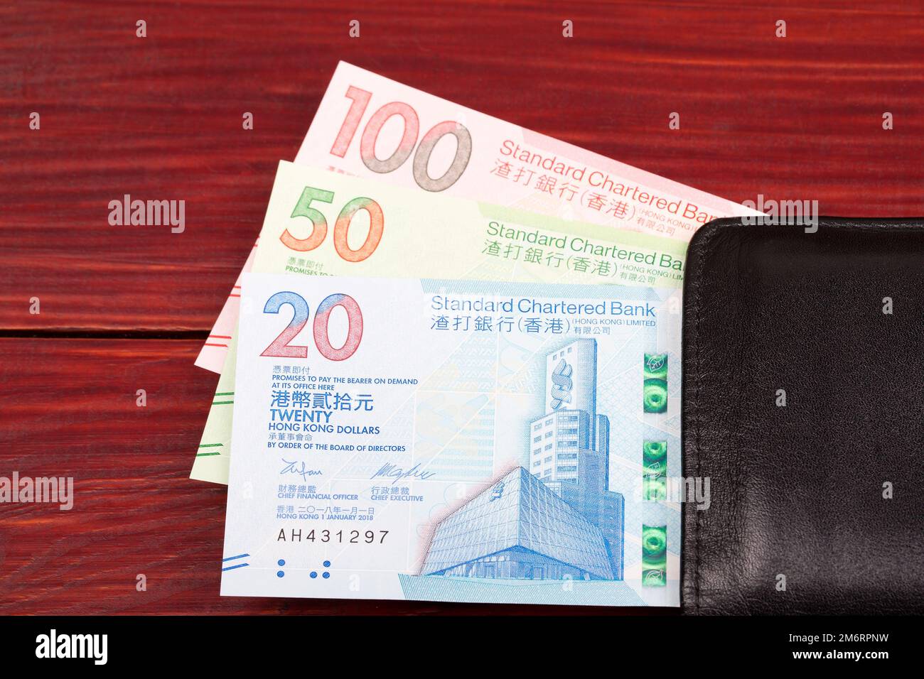 Dollaro di Hong Kong una nuova serie di banconote nel portafoglio nero Foto Stock