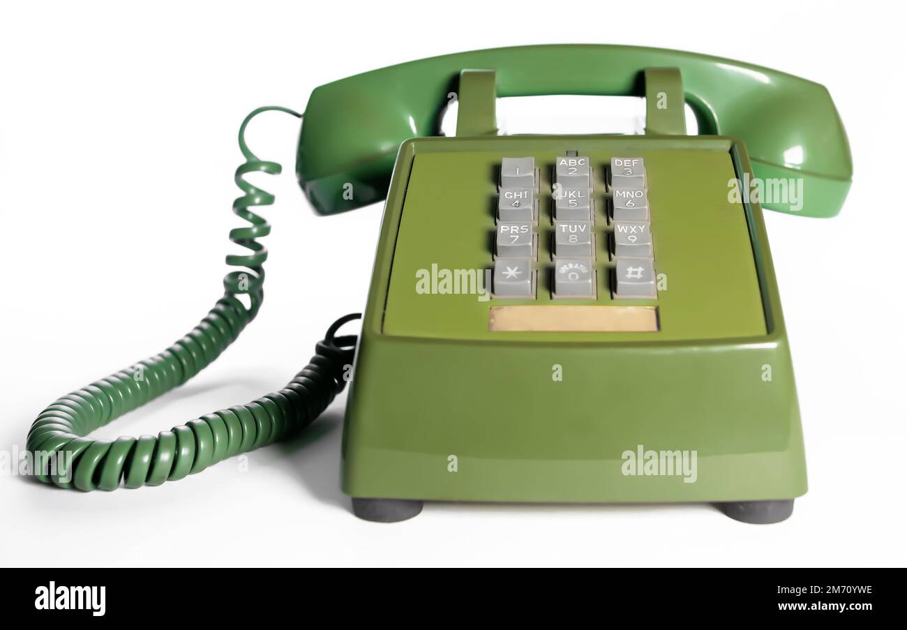 Telefono con manopola a pulsante retro. Telefono fisso verde avocado vintage. Foto Stock