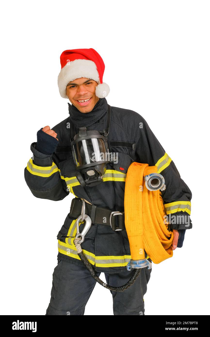 Sorridente pugno vigile del fuoco durante Natale Foto Stock