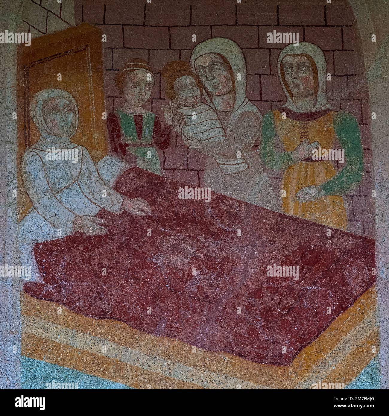 La nascita di un futuro santo cristiano, Antonio l'abate o Antonio il grande: Il neonato Anthony avvolto in fasce a cavallo viene mostrato a sua madre. Particolare del tardo XV secolo affresco pre-rinascimentale di un membro della famiglia longobarda Baschenis sulla parete esterna della Chiesa di Sant'Antonio Abate a Pelugo, Trentino-alto Adige, Italia. Parte di un ciclo di affreschi che racconta la vita di Sant'Antonio e un esempio di biblia pauperum. Foto Stock