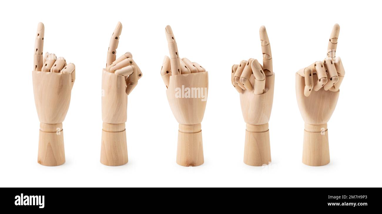 Mano di manichino in legno che punta su sfondo bianco. Angoli diversi. Gesti. Foto Stock