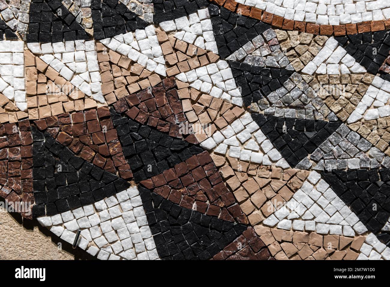 Mosaico di pietra, motivo triangolare, texture foto di sfondo in primo piano Foto Stock