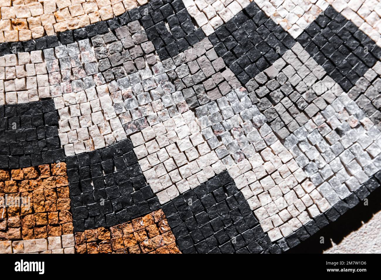 Classico motivo a mosaico in pietra, texture foto di sfondo in primo piano Foto Stock