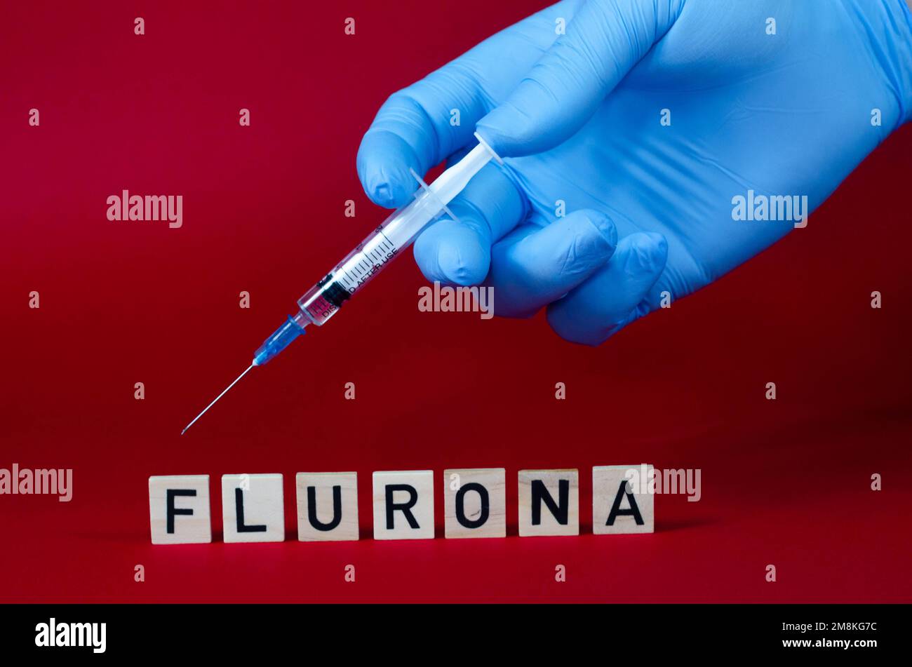 Flurona - COVID e influenza allo stesso tempo. Una nuova malattia nel mondo. Concetto medico Foto Stock