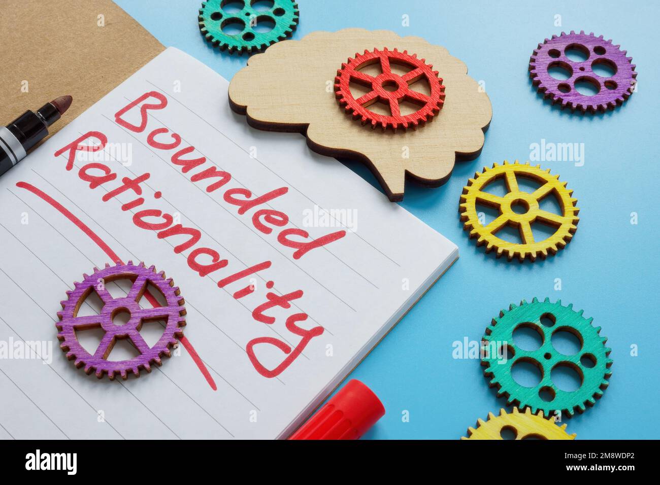Iscrizione di razionalità limitata e ruote dentate colorate. Foto Stock