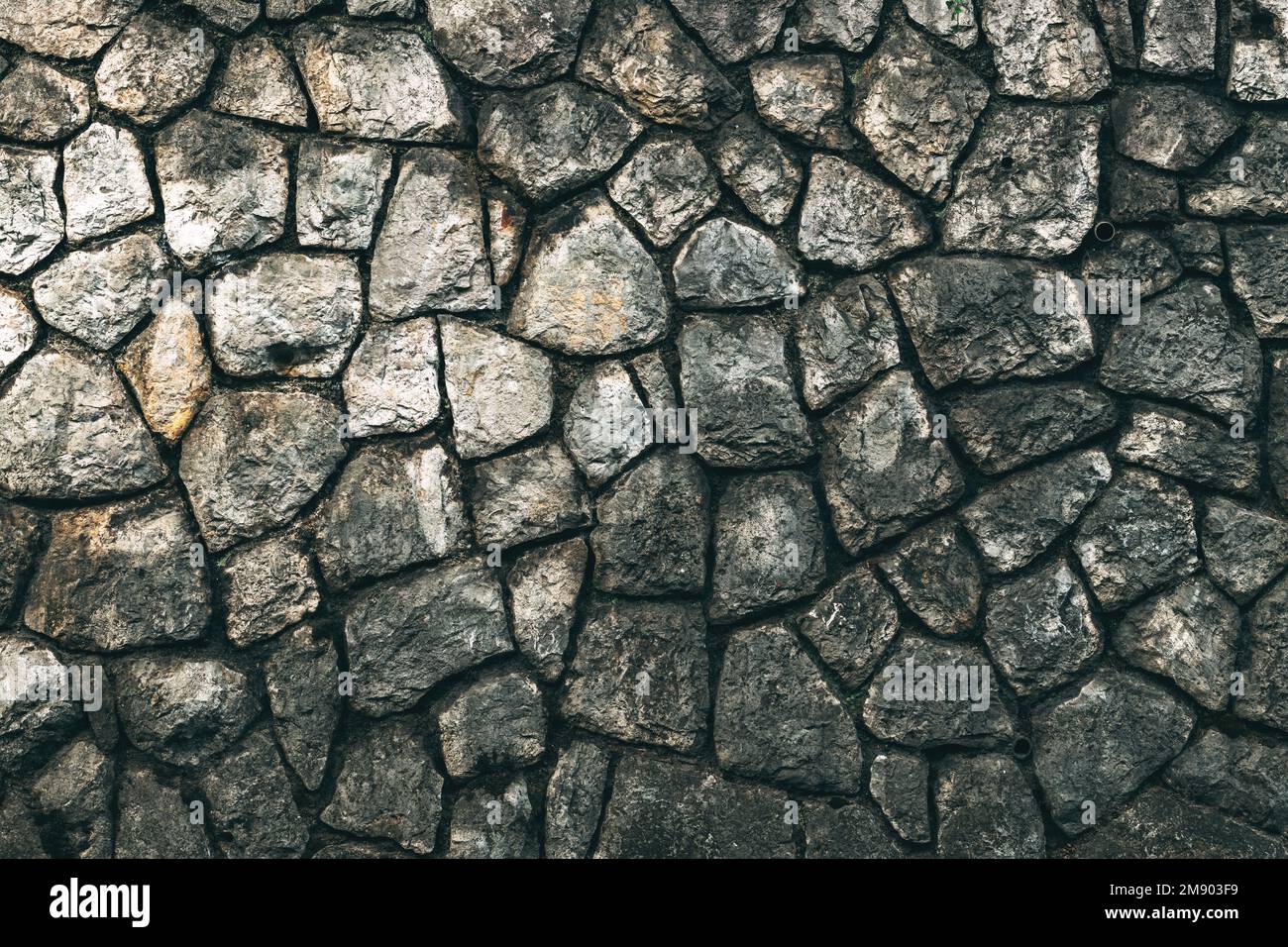 Vecchio modello di facciata in pietra come sfondo. Particolare dalla città di Lovran in Croazia. Foto Stock