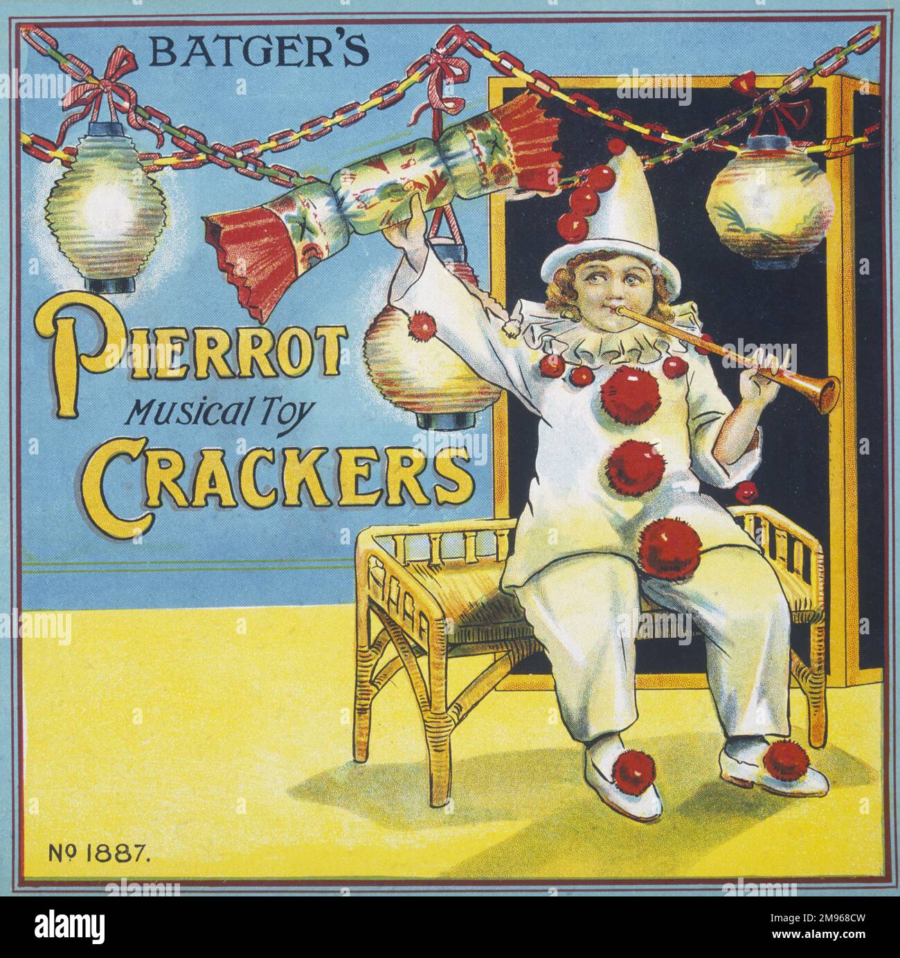 Etichetta per una scatola di Batgers Pierrot Musical Toy Christmas Crackers con un ragazzino che indossa un abito clown e lancia un corno mentre brandisce un grande cracker. Foto Stock