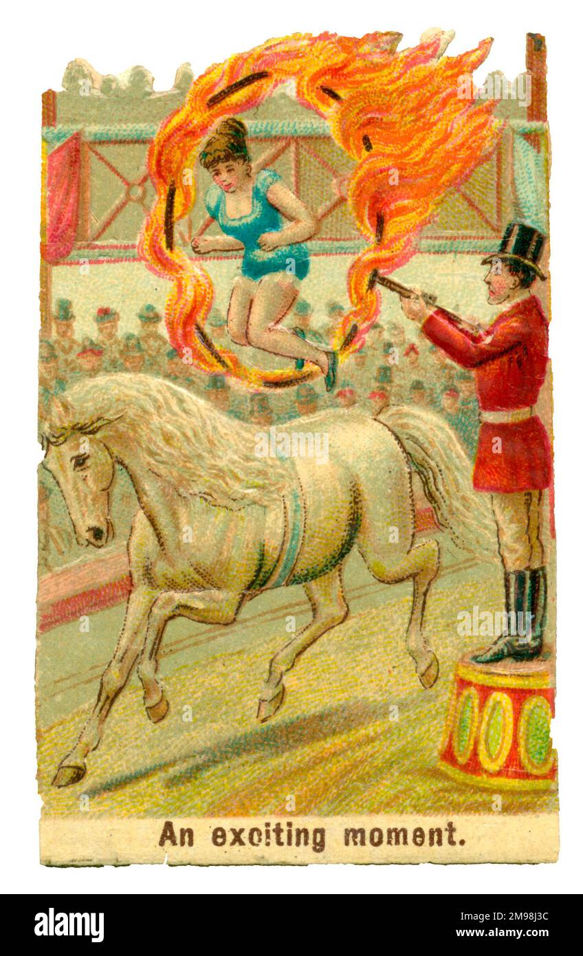 Scarto Vittoriano - Circus Horse Rider che salta attraverso un anello di fuoco - un momento emozionante. Foto Stock