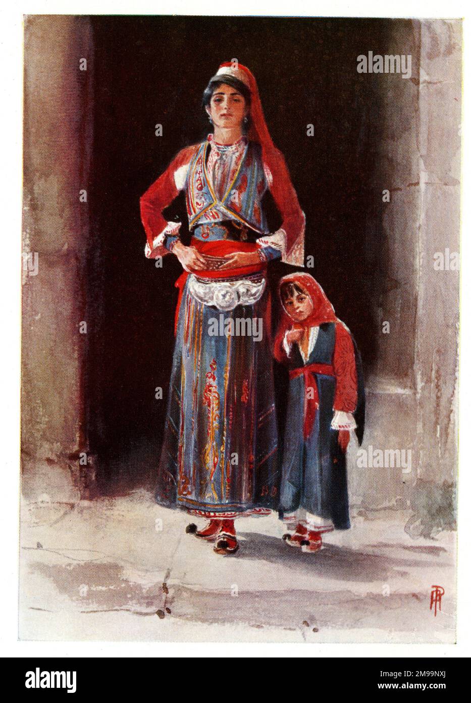 Contadini albanesi in costume nazionale colorato, donna e bambino. Foto Stock