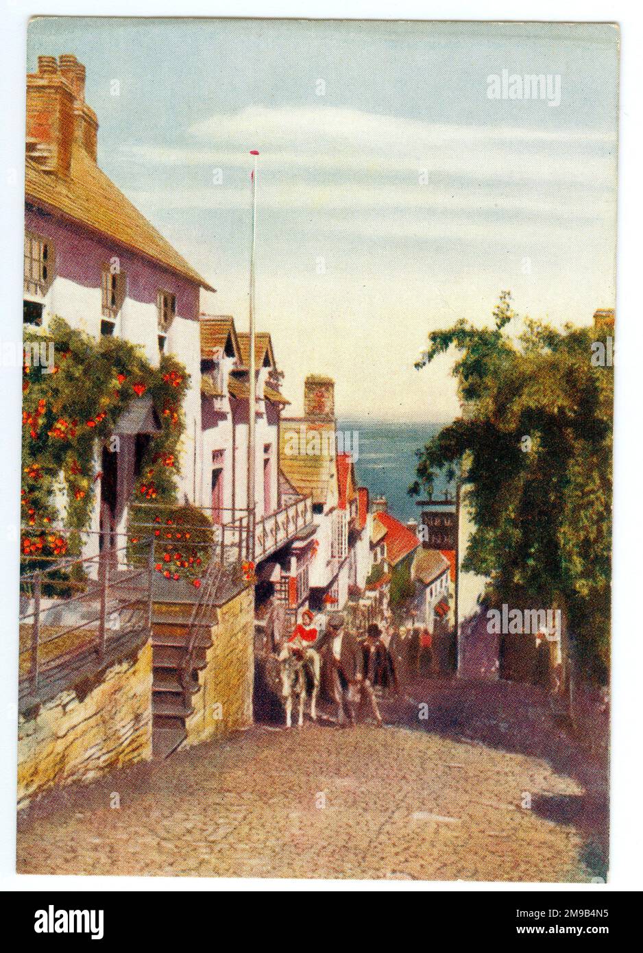 La scheda è una delle serie di schede pubblicitarie offerte da Godfrey Phillips Tobacco Company basato su Great Western Railway Posters. La vista è in discesa oltre il New Inn. Foto Stock