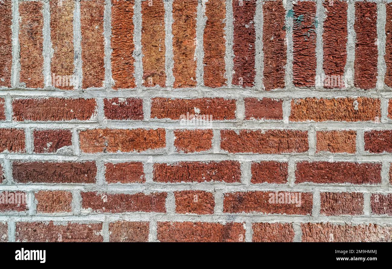 Close-up di rosso la parete in mattoni Foto Stock