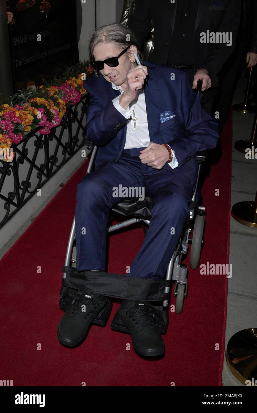 Shane MacGowan poses for photographers upon arrival at the Shane