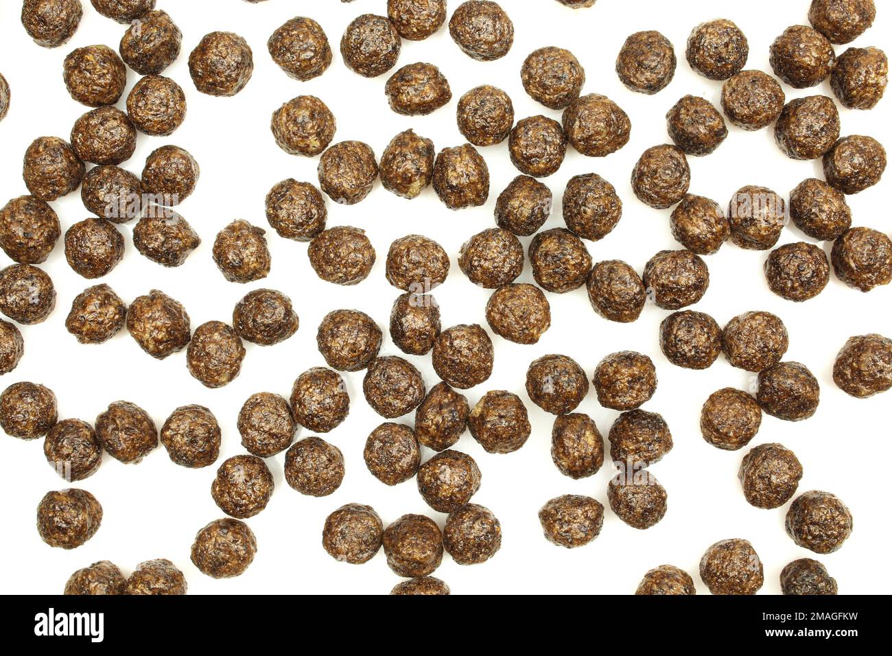 Sfondo texture cioccolato palline di cornflake isolato su sfondo bianco Foto Stock