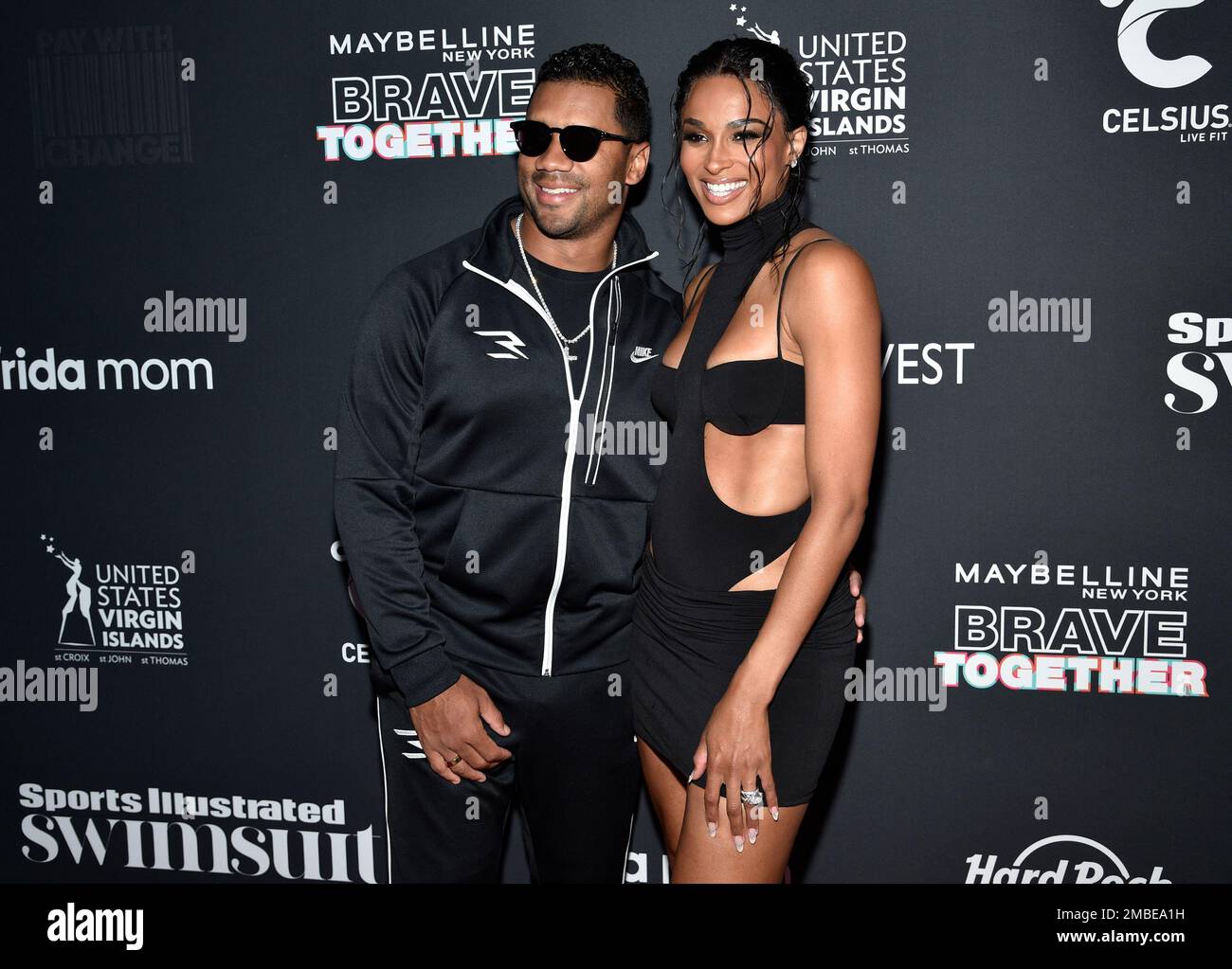 NFL quarterback Russell Wilson, left, and wife Ciara attend the Sports ...