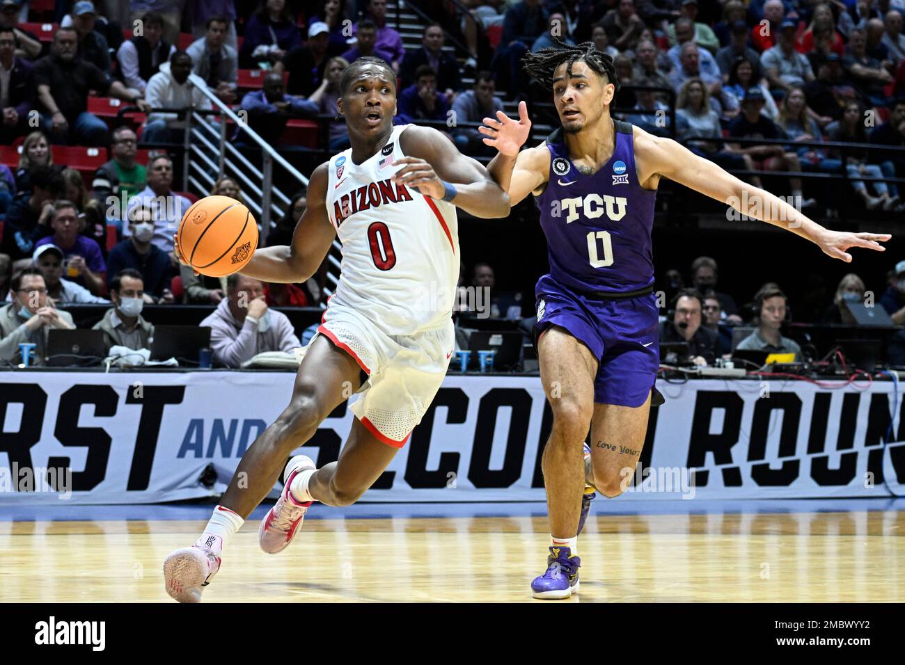 Arizona guard Bennedict Mathurin, left, drives around TCU guard Micah ...