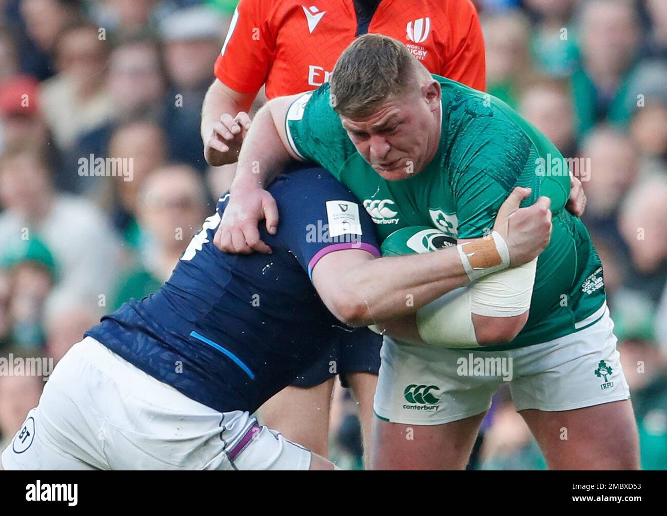 Ireland's Tadhg Furlong, right is tackled by Scotland's Jonny Gray during  the Six Nations rugby union international match between Ireland and  Scotland at the Aviva Stadium in Dublin, Ireland. (AP Photo/Peter Morrison