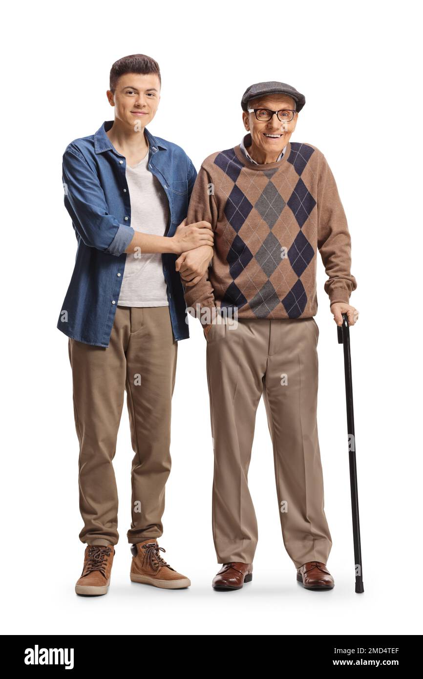 Ritratto completo di un ragazzo che aiuta un uomo anziano a camminare con una canna isolata su sfondo bianco Foto Stock