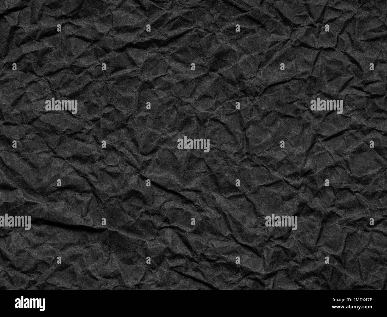 Grana carta nera opaca arricciata. Sfondo per artigianato, decorazione di nuovi disegni anno, testo, lettere, salvaschermo. Materiale vintage Foto Stock