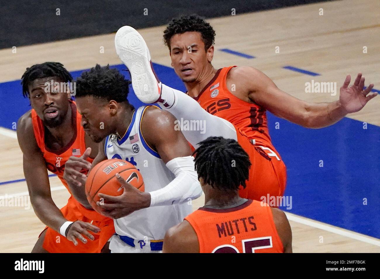 Virginia Tech's Keve Aluma, right rear, collides with Pittsburgh's