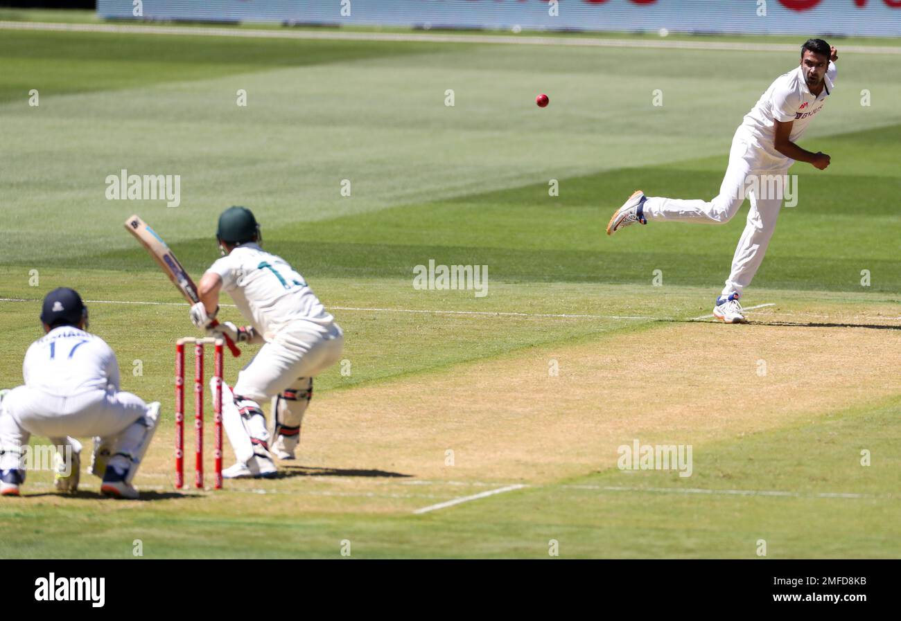 India's Ravichandran Ashwin, right, bowls to Australia's Matthew Wade