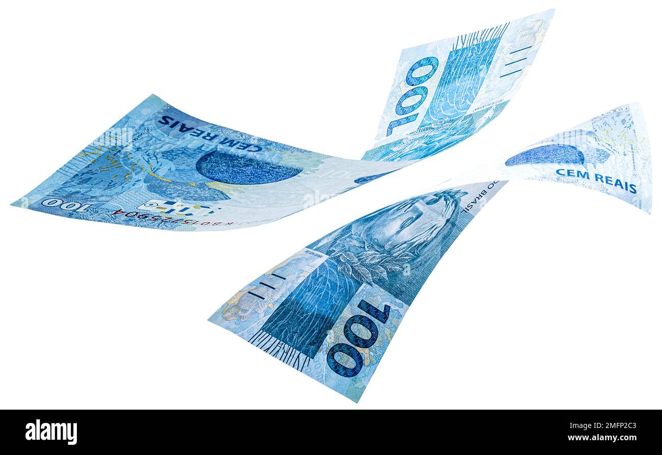 banconote di un centinaio di reais dal brasile che cadono su sfondo bianco isolato. Caduta della valuta brasiliana, svalutazione, crisi economica. Foto Stock