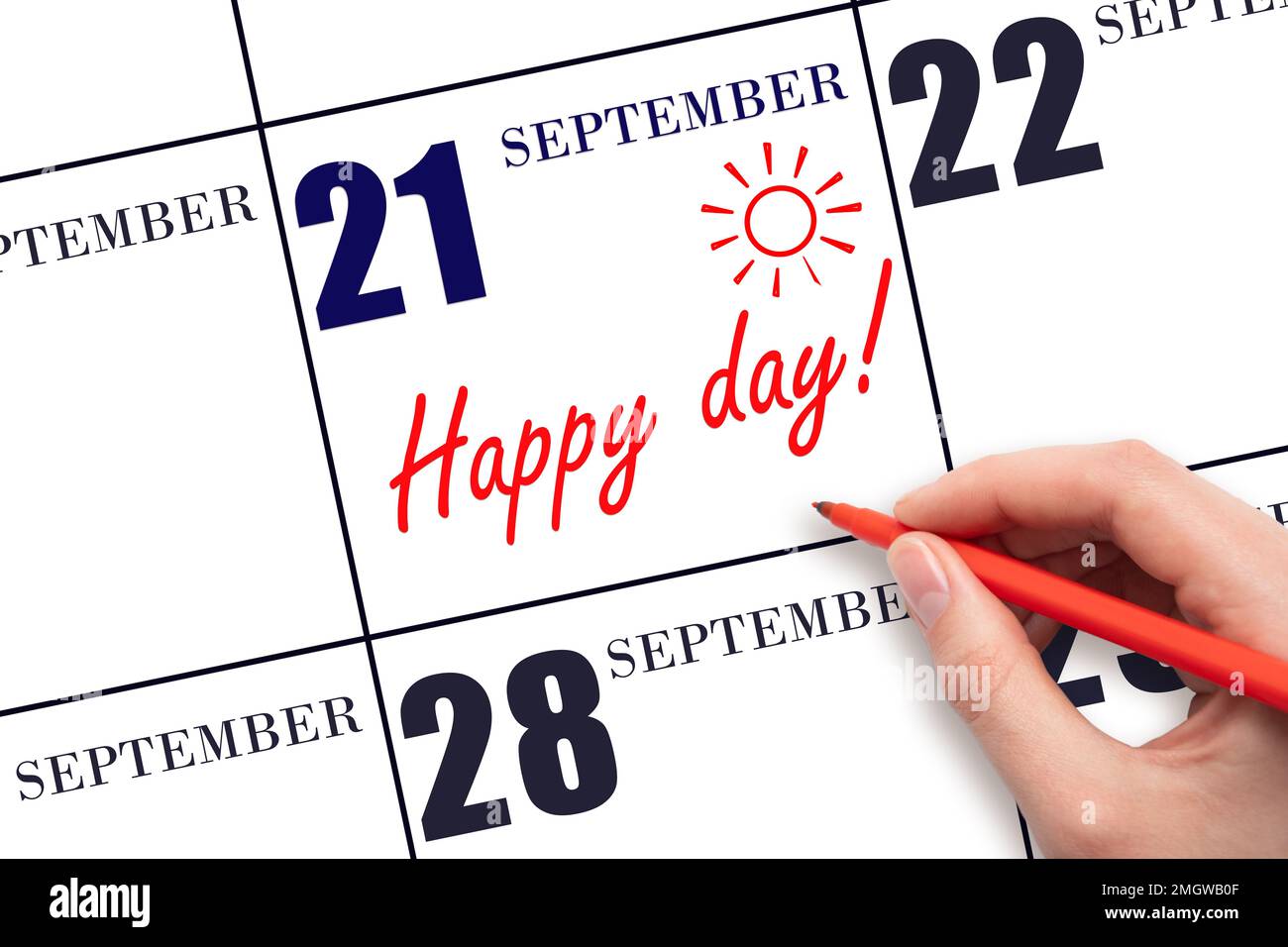 21st° giorno di settembre. Scrivere a mano il testo HAPPY DAY e disegnare il sole sulla data di calendario 21 settembre. Salvare la data. Vacanza. Motivazione. AUT Foto Stock