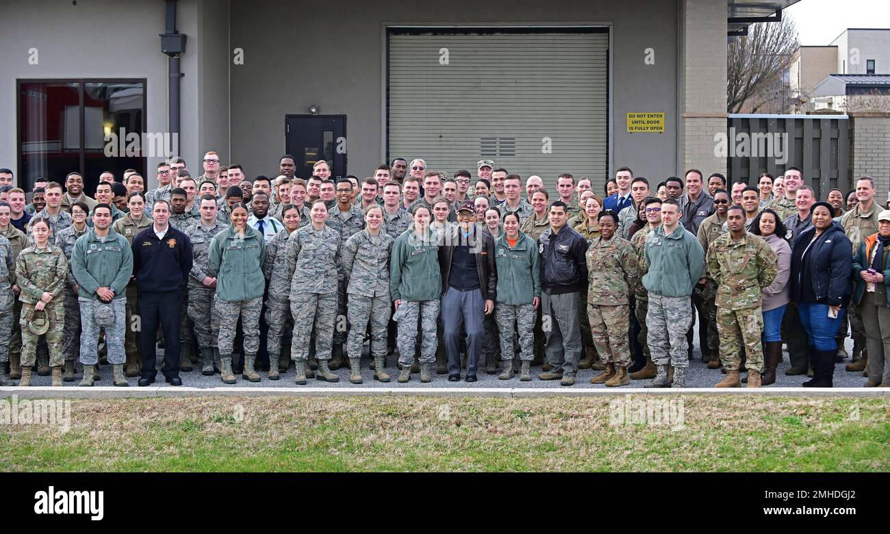 Retired U.S. Air Force Col. Charles McGee, a Tuskegee Airman and a decorated veteran, poses with the 436 Aerial Port Squadron personnel at Dover Air Force Base during a 100th birthday celebration in Dover, Delaware, Friday, Dec. 6, 2019. McGee's birthday is Dec. 7. (AP Photo/David Tulis) Foto Stock