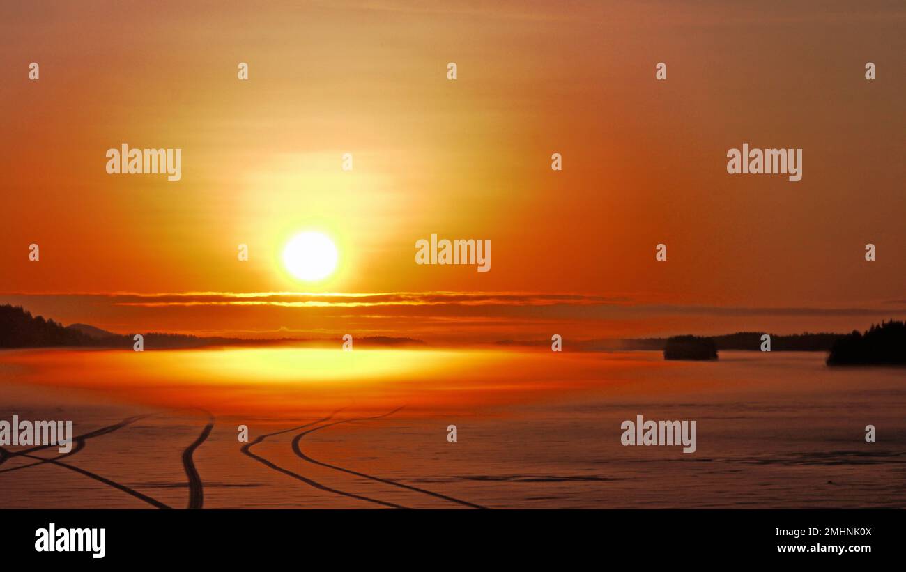 Alba di metà inverno sul lago Suvasvesi. Vehmersalmi, Kuopio, Finlandia, 2023-01-27 09:11 +02. Temperatura -10 °C, vento NW 2 m/s. Foto Stock